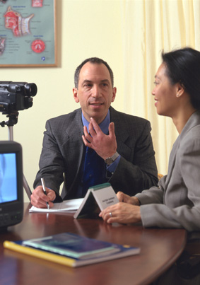 Leiter and student with camcorder